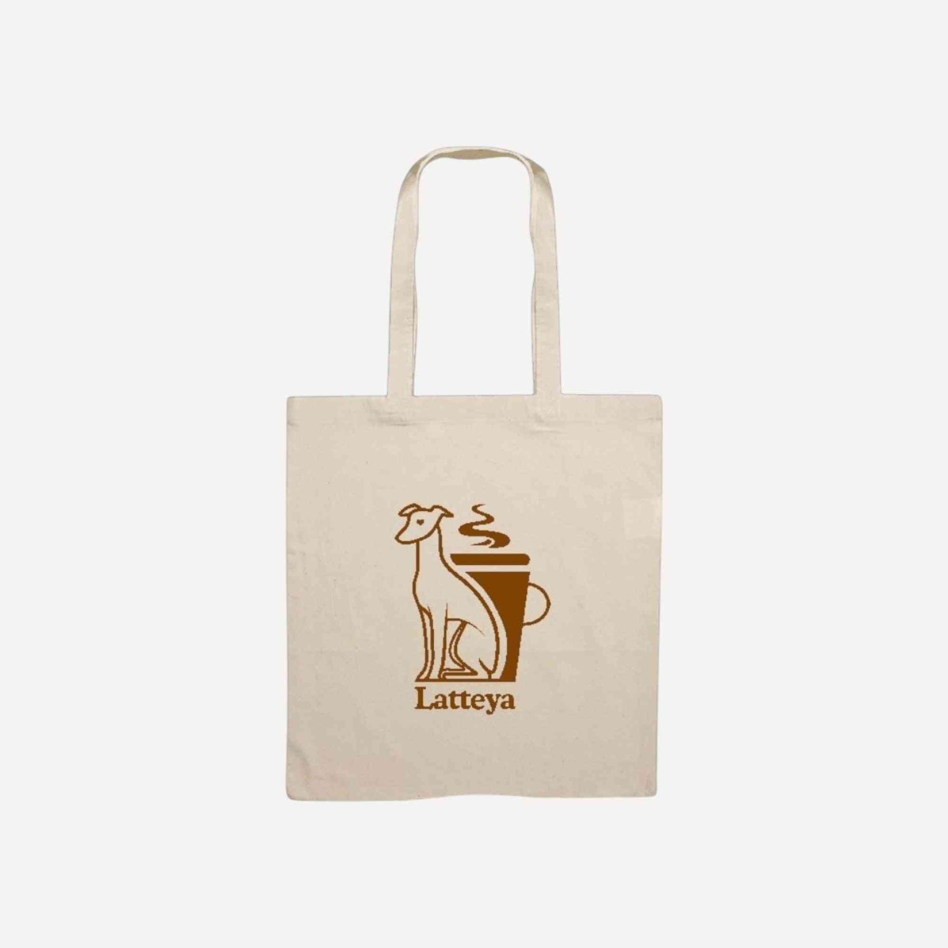 Tote Bag Latteya en coton naturel avec illustration d’un chien et d’un café, idéal pour les sorties avec ton chien. Accessoire pratique et stylé.